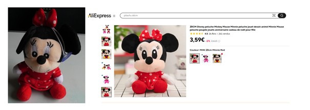 Miki miška Minnie v rdeči obleki s pikami, mašnica med ušesi je prav tako rdeča z belimi pikami. Igrača ima prisesalno kapico.