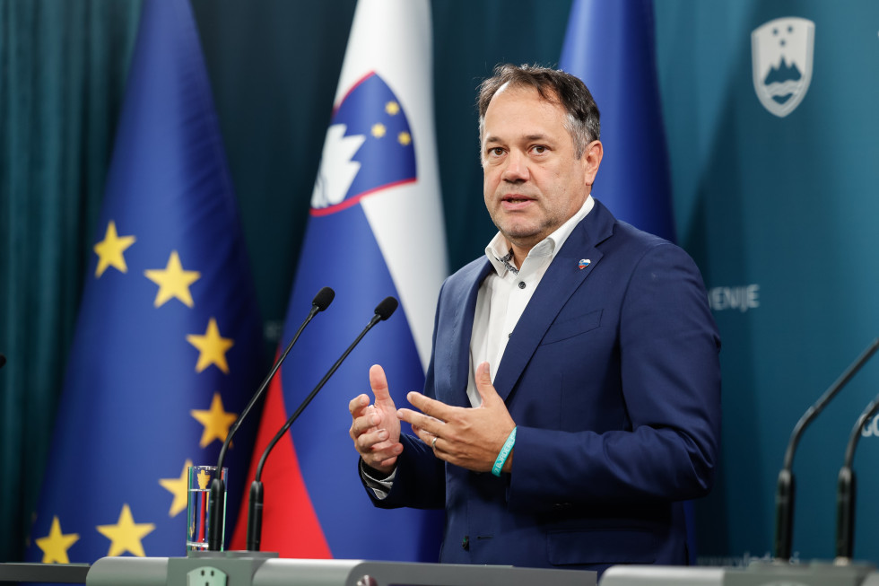 a man in front of flags