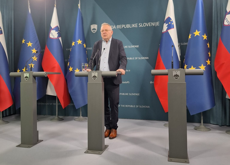 A man stands behind the podium.