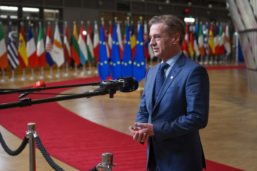 A man standing in front of microphone.