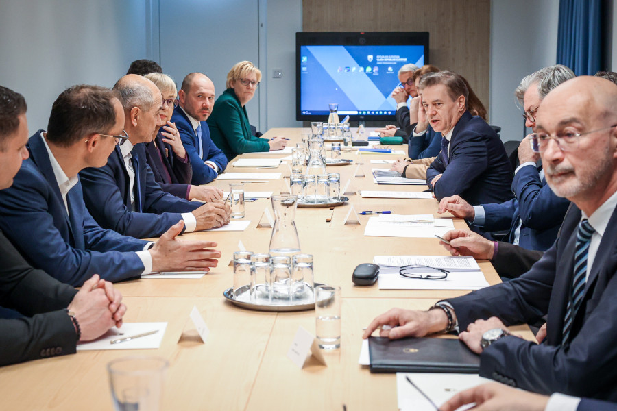 people sitting across a long table