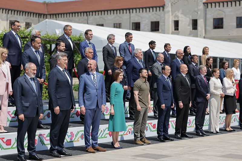 a group of people standing on top of a stage.