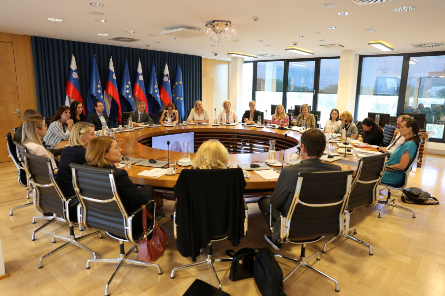 Meeting participants sit at a round table