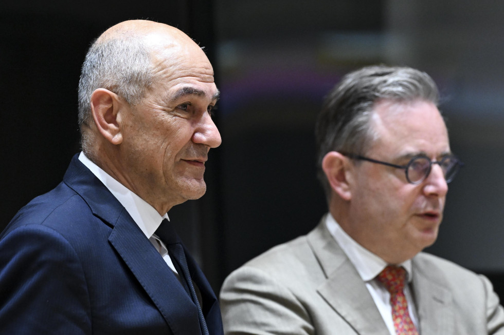 Janez Janša and Bart De Wever are standing.