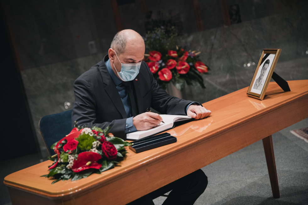 The prime minister signs the remembrance book