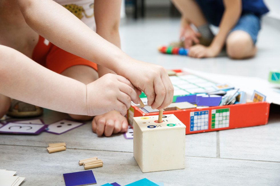 Kids hands playing with cubes