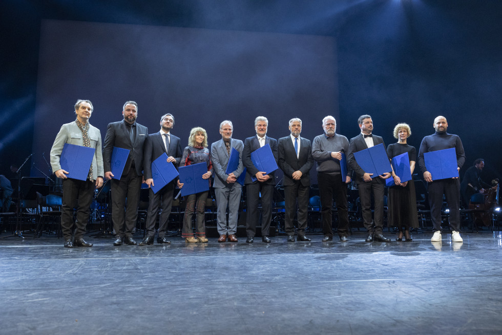 Group of people standing on the stage of Gallus Hall