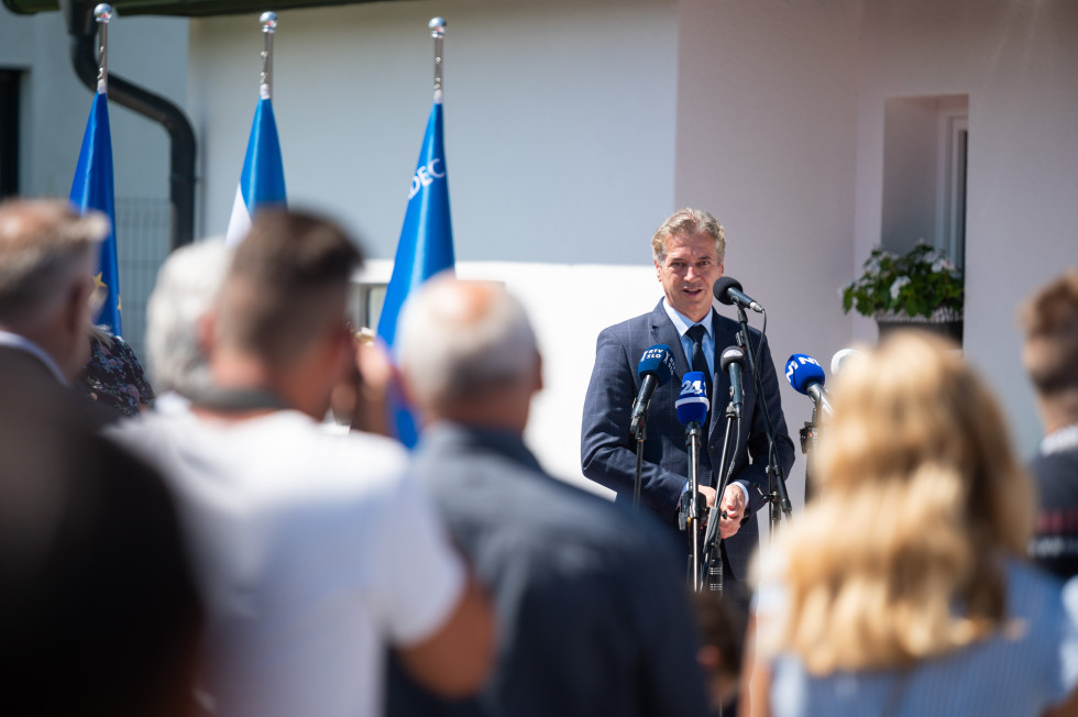 Prime Minister stands in front of a microphone during his address