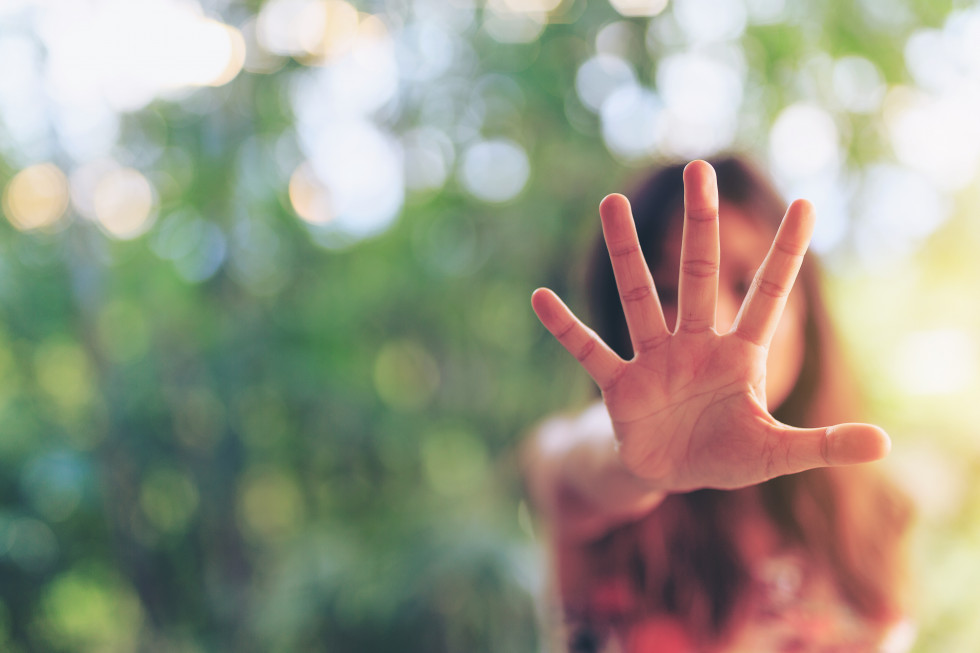 A woman stretches out her hand