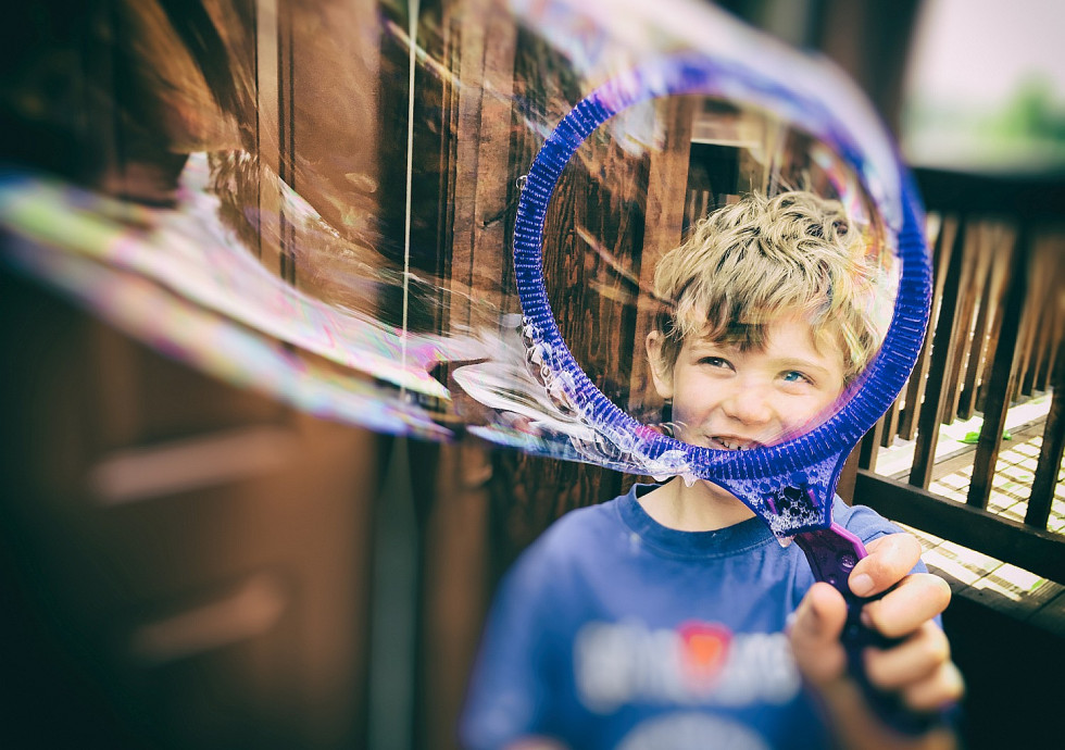 Boy making bubbles.