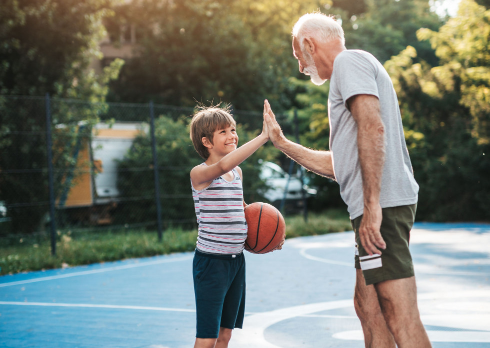 High five between a child and a man