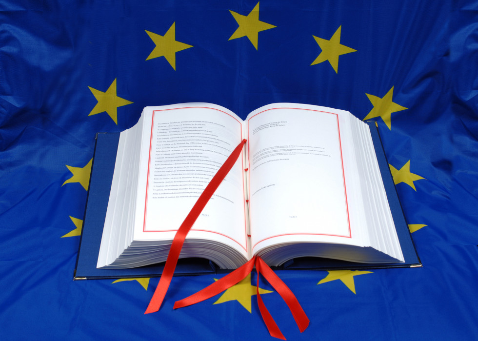 The Lisbon Treaty is an open book on the EU flag