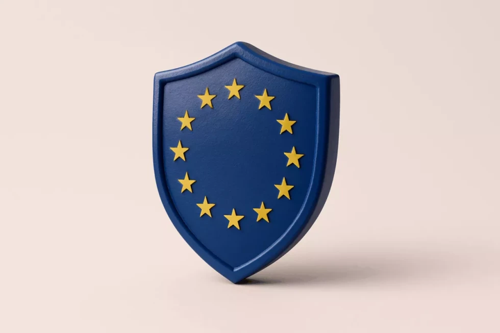 Moder ščit z zlatimi zvezdami, razporejenimi v krog, ki ponazarja simbol Evropske unije.