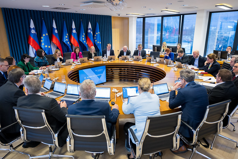 Members ofthe Cabinet sitting behind the round desk