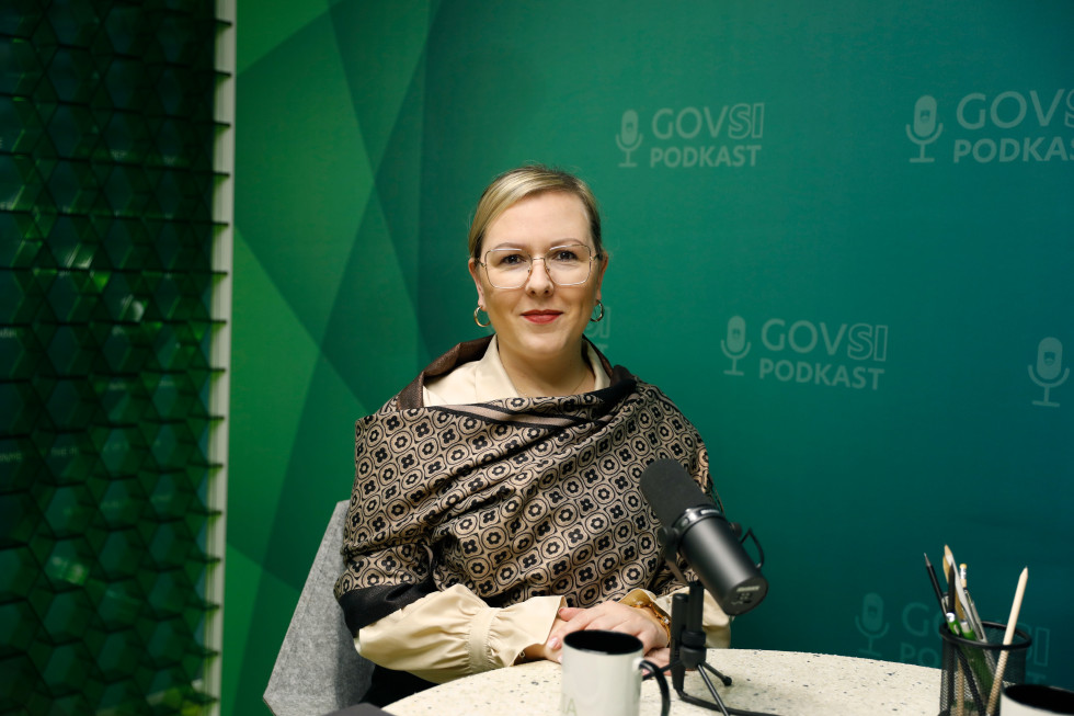 Minister Mateja Čalušić sitting at a table.