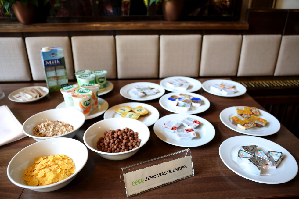 Food on the table in plastic packaging and on plates.