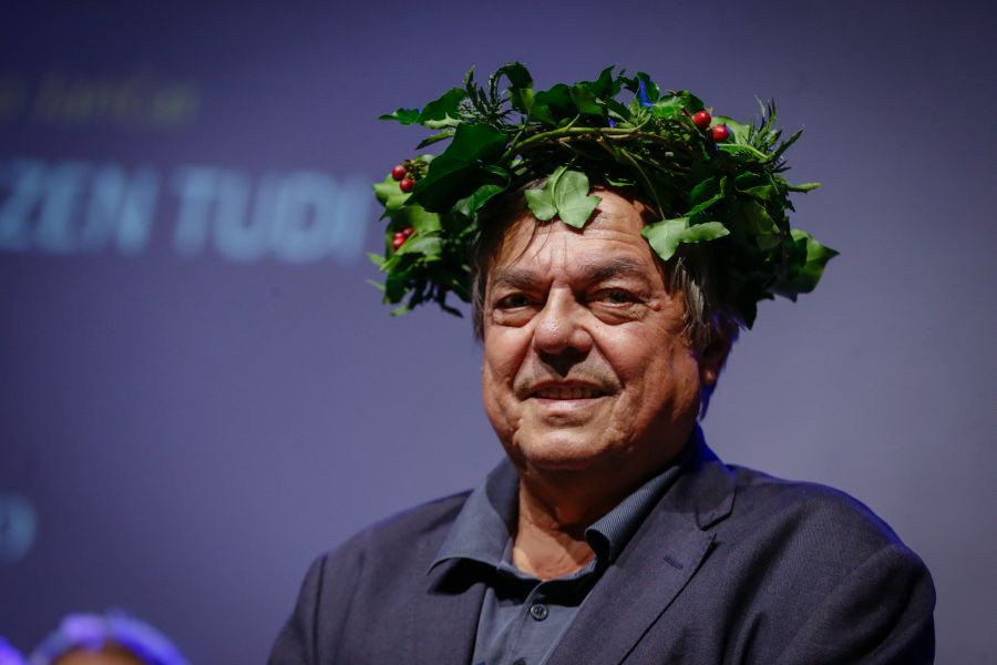 Drago Jančar has a wreath on his head.