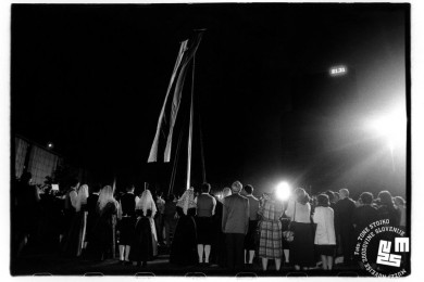 Raising of Slovenian Flag, a crowd of people, some in national costumes