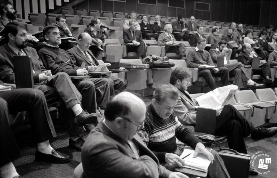 Members sit in the stands in the courtroom.