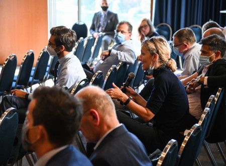 A lady from the audience asking questions